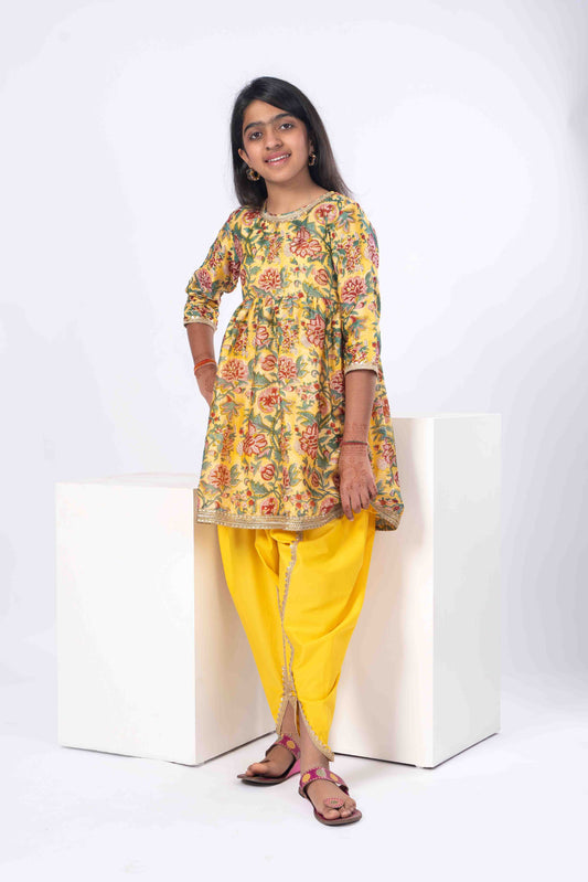 floral yellow girls kurta with yellow dhoti pants.