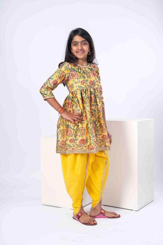floral yellow girls kurta with yellow dhoti pants.